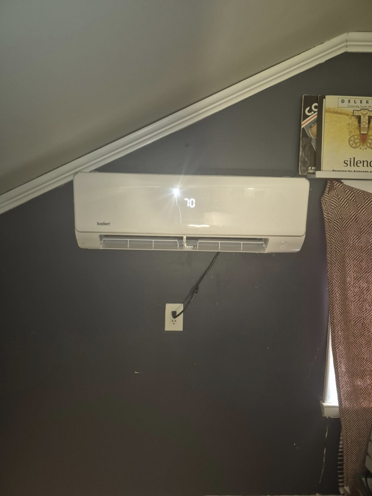 An indoor Kaden mini-split air handler unit showing '70' on the display, installed by Kirk Heating & Air Conditioning in Summerville, SC.