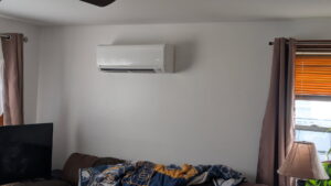 An indoor mini-split head unit installed on a living room wall by Climate Diagnostics in Buffalo, NY.