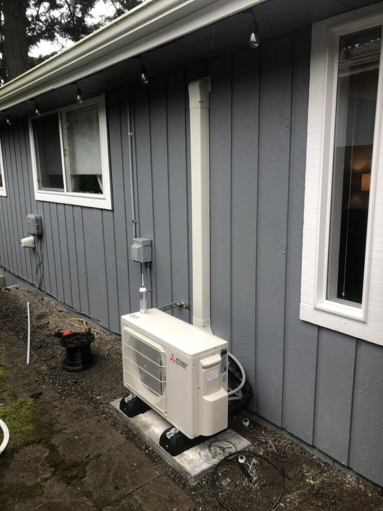 An outdoor mini-split unit and piping installed by Energy Technologies in Seattle, WA.