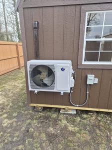 A newly installed mini-split outdoor condenser unit with the fan visible, completed by Jesse's HVAC LLC in Newport News, VA.