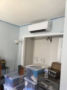 An indoor mini-split unit installed above a doorway in a room by Green Air Heating&Cooling in Philadelphia, PA.