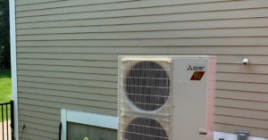 An outdoor Mitsubishi Electric HVAC condenser unit installed by Paul Mechanical LLC in Merrimack, NH