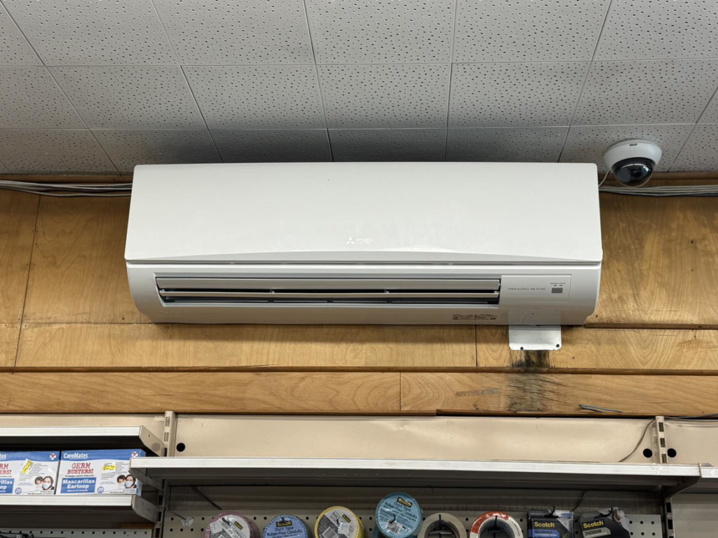 An indoor Mitsubishi Electric mini-split air conditioning unit mounted on a wall by D and C Mechanical, Inc. in Tewksbury, MA.