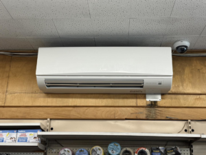 An indoor Mitsubishi Electric mini-split air conditioning unit mounted on a wall by D and C Mechanical, Inc. in Tewksbury, MA.