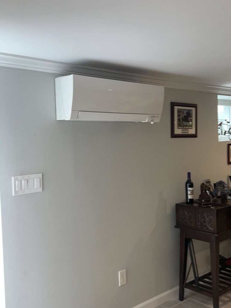 An indoor Mitsubishi Electric mini-split unit installed on a wall by Elite Heating and Cooling in Livonia, MI.