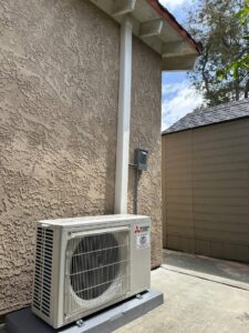 A newly installed Mitsubishi Electric mini-split outdoor condenser unit by Affordable Heating and Air in Chatsworth, CA.