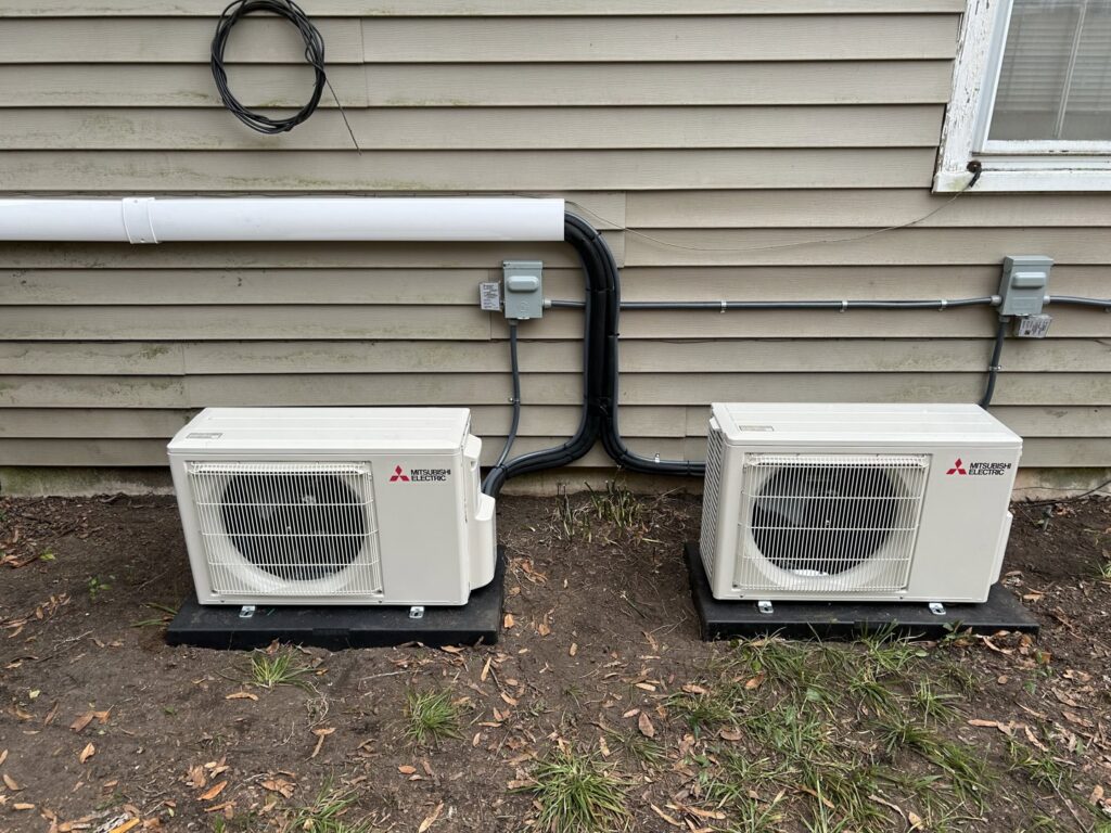 Two newly installed Mitsubishi Electric mini-split outdoor units by Krantz Kooling & Heating in West Columbia, SC