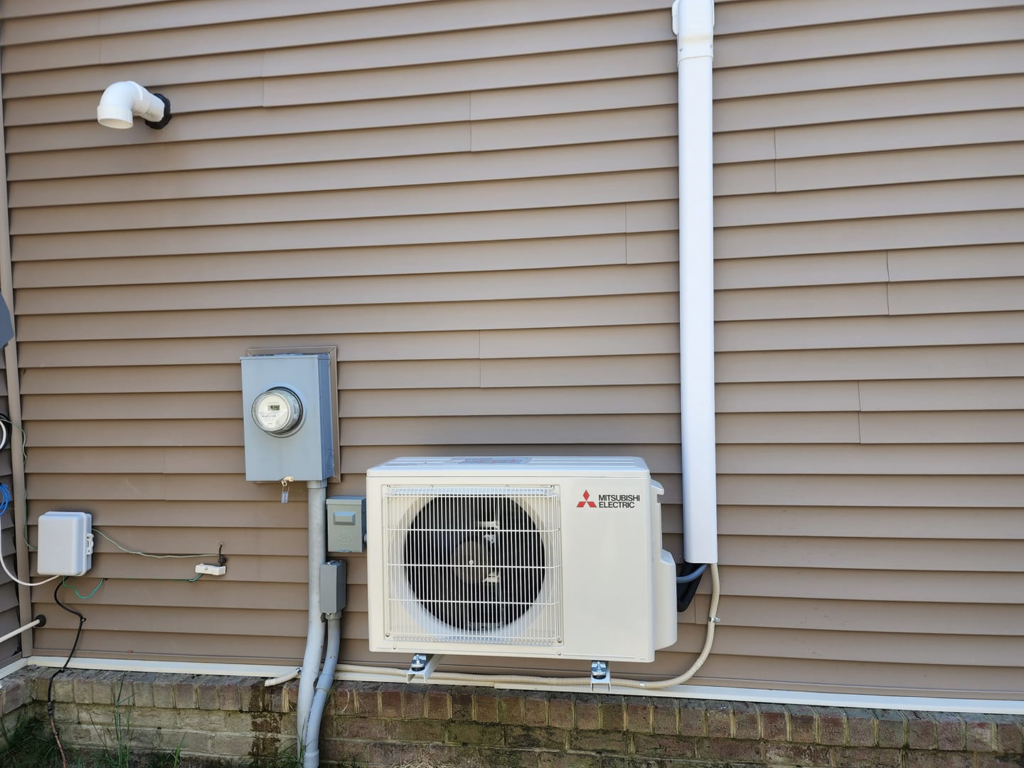 A newly installed Mitsubishi Electric mini-split outdoor unit by Mike Wells Services in Suffolk, VA.
