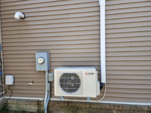 A newly installed Mitsubishi Electric mini-split outdoor unit by Mike Wells Services in Suffolk, VA.
