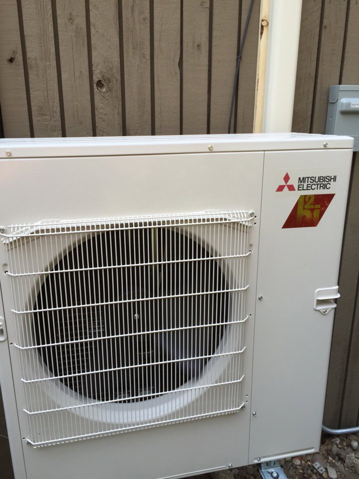 An outdoor Mitsubishi Electric mini-split condenser unit installed by Any Climate Mechanical HVAC in Sandy, UT.