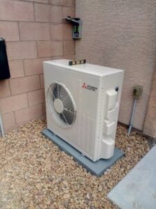 A newly installed Mitsubishi Electric mini-split outdoor condenser unit by Ace A/C & Heating in Henderson, NV.