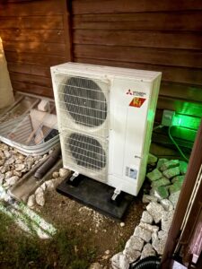 A newly installed Mitsubishi Electric outdoor HVAC unit by Cool y Caliente HVAC Services in Bonner Springs, KS.