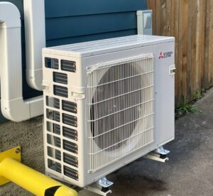An outdoor Mitsubishi Electric HVAC unit recently installed by Progressive Comfort Solutions in Seattle, WA.