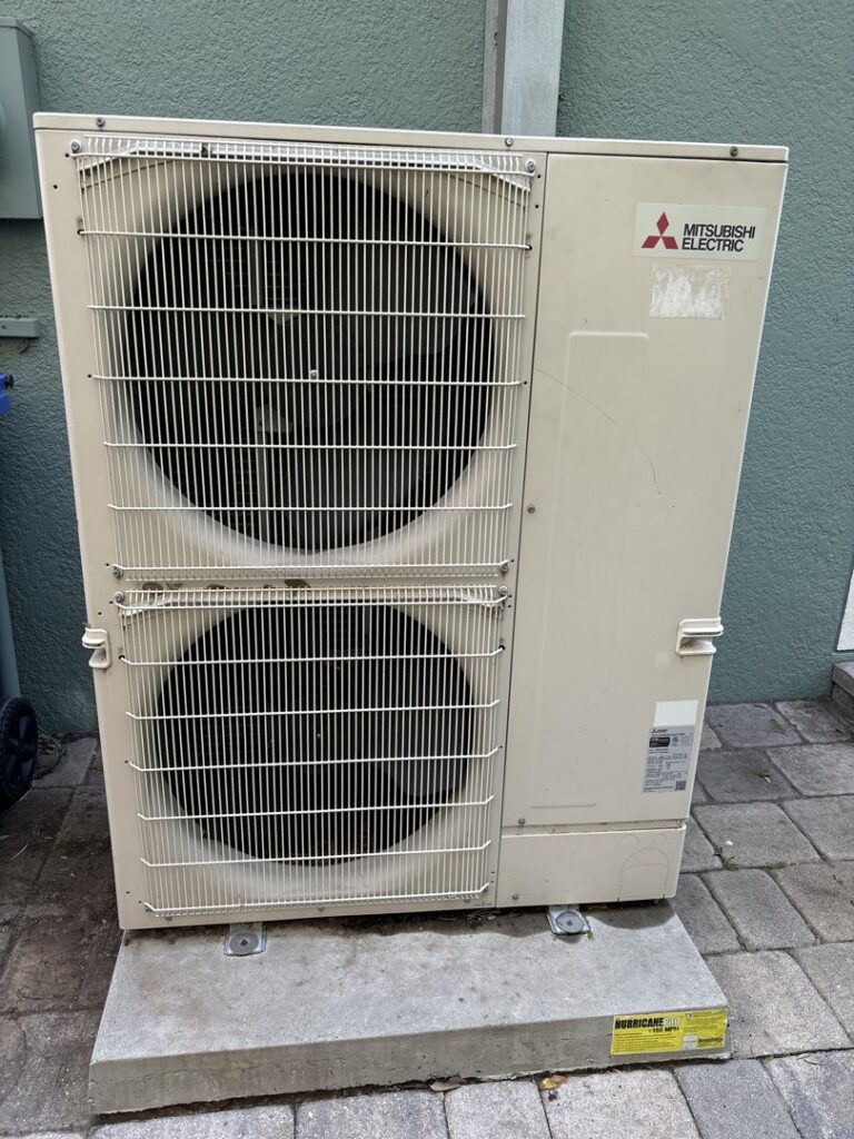 An outdoor Mitsubishi Electric HVAC unit installed by Uplifting Air, LLC in San Antonio, FL.