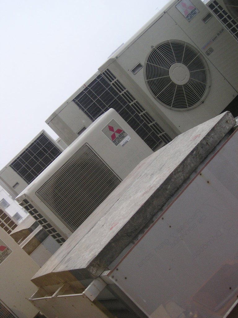 Several Mitsubishi Electric outdoor HVAC units installed, showcasing work by Trenary Service Company in Martinsburg, WV.