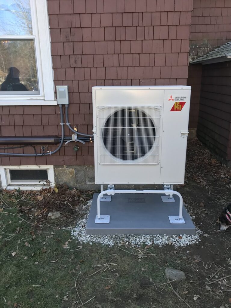 An outdoor Mitsubishi heat pump unit installed by Quality Comfort Inc. in Aston, PA