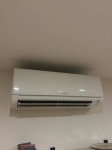 A clean Mitsubishi mini-split indoor unit installed on a wall by Black Oak HVAC in Derry, NH