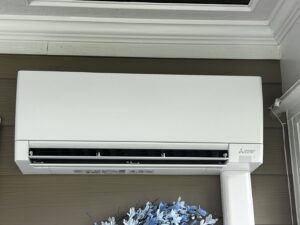 A Mitsubishi mini-split indoor unit expertly installed on a wall by Pappy's Heating & Air INC in Clayton, NC.