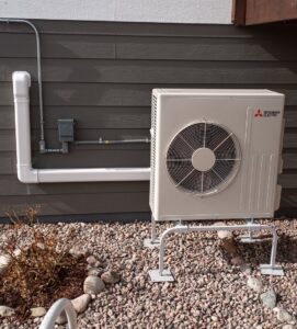 An outdoor Mitsubishi Electric mini-split unit installed by Advanced Comfort Solutions, Inc. in Cheyenne, WY.
