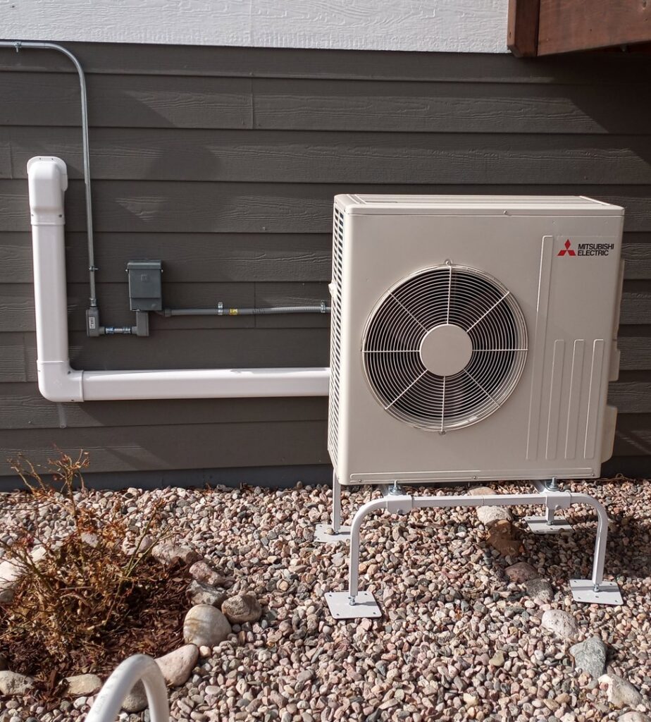 An outdoor Mitsubishi Electric mini-split unit installed by Advanced Comfort Solutions, Inc. in Cheyenne, WY.