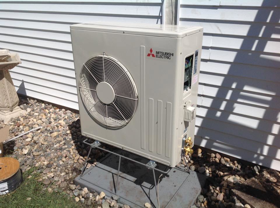 A newly installed Mitsubishi Electric mini-split outdoor unit by Aire Serv of Fargo, ND.