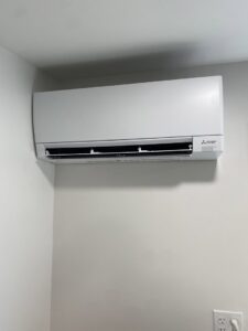 A Mitsubishi Electric mini-split indoor unit installed on a wall by Heatwave Heating & Air LLC in Federal Way, WA.