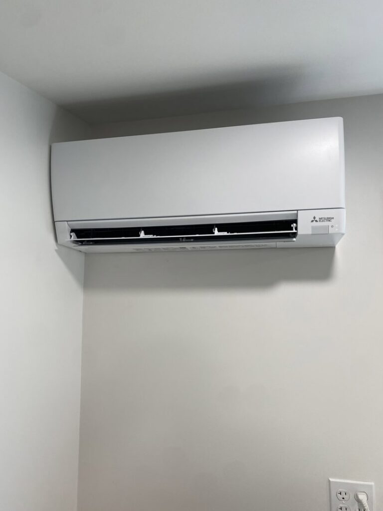 A Mitsubishi Electric mini-split indoor unit installed on a wall by Heatwave Heating & Air LLC in Federal Way, WA.