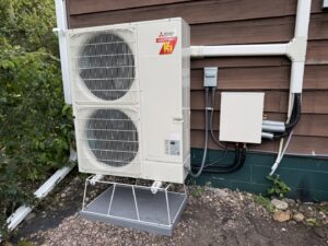 A Mitsubishi mini-split heat pump outdoor unit installed by True Comfort Heating and Cooling in Sherwood, AR.