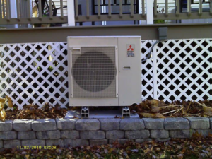 A close-up of a Mitsubishi outdoor HVAC unit installed by Trainor Mechanical in Nelson, BC