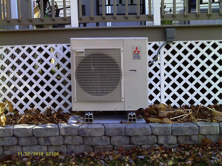 A close-up of a Mitsubishi outdoor HVAC unit installed by Trainor Mechanical in Nelson, BC
