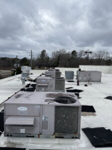 Mixed household and construction debris piled for cleanup and general junk removal by Evenflow Heating and Air, LLC in Woodstock, GA.