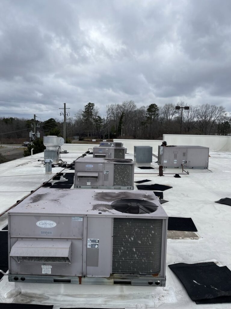 Mixed household and construction debris piled for cleanup and general junk removal by Evenflow Heating and Air, LLC in Woodstock, GA.