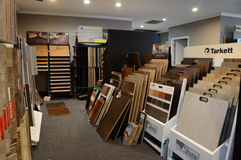 A showroom featuring mixed flooring displays and a carpeted floor at Floor Concepts in Owensboro, KY.
