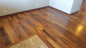 Finished mixed hardwood flooring installation in a living room by Carpets By Cal Inc in Vernal, UT