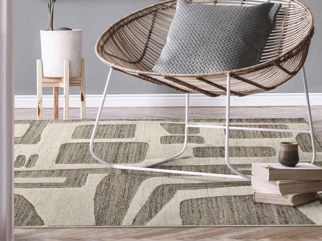 A modern living room setting with a unique patterned area rug from Morency Flooring in New Bedford, MA.