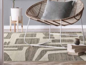 A modern living room setting with a unique patterned area rug from Morency Flooring in New Bedford, MA.