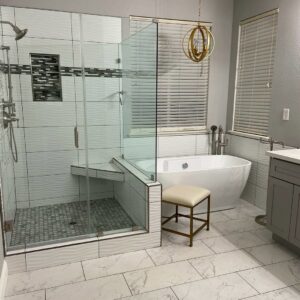 Modern bathroom with walk-in shower, freestanding tub, and white tile flooring by Sulcas Carpets & more in Elk Grove, CA