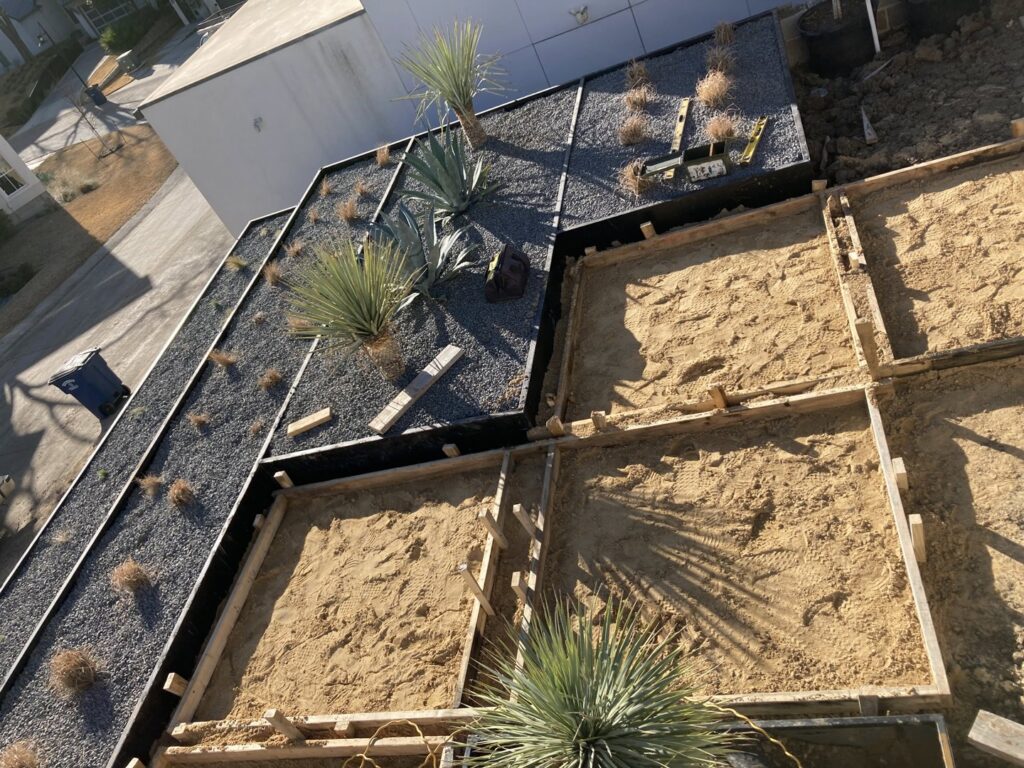A modern black automatic gate with horizontal slats installed by Craftsman Automatic Gates in Dallas, TX