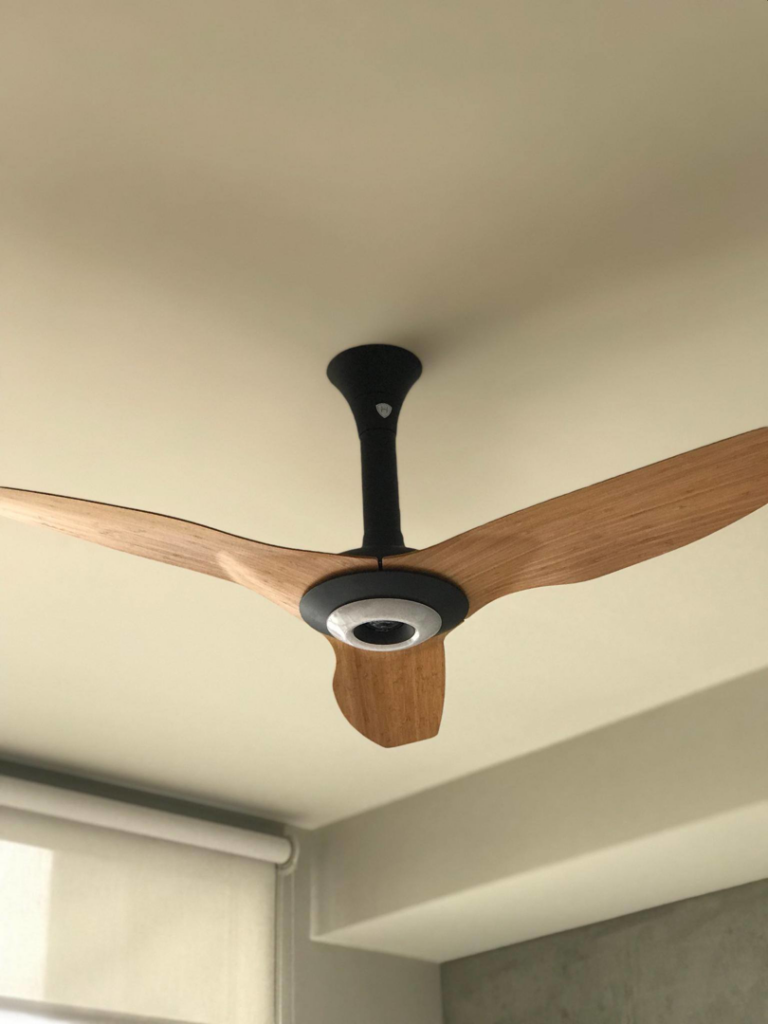 A modern wooden blade ceiling fan expertly installed by Premo Electric in Spring Valley, CA