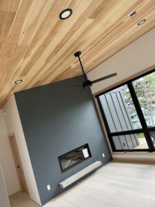 A modern ceiling fan and recessed lighting installed in a room by Schroeder Electric in Duluth, MN.