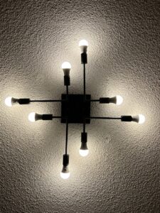 A modern ceiling light fixture with multiple LED bulbs, installed by Jeremy Electrical in Roeland Park, KS.