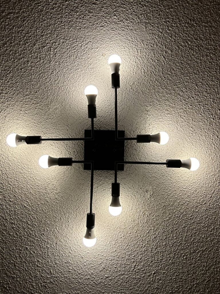 A modern ceiling light fixture with multiple LED bulbs, installed by Jeremy Electrical in Roeland Park, KS.