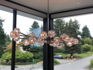 A stylish modern chandelier fixture professionally installed by Obot Electric in Bellevue, WA