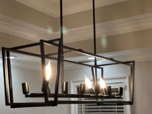 A modern chandelier with exposed bulbs, likely installed by Mr. Electric of Montgomery County Alabama in Montgomery, AL.