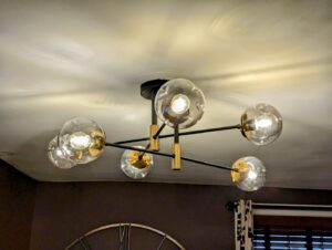A stylish modern chandelier light fixture installed on a ceiling by GEN3 Electric & HVAC in Philadelphia, PA.