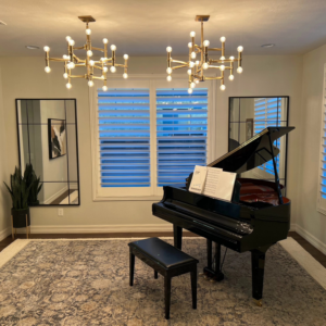 Two modern chandeliers professionally installed in a living space by Silo Electric in Gilbert, AZ