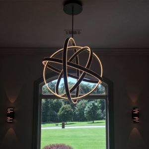 A modern spherical chandelier and two wall sconces installed by Natural State Electric LLC in Fayetteville, AR.