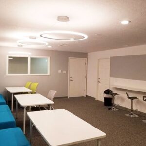 Room with modern circular and recessed lighting installed by True Light Electric in Albuquerque, NM.