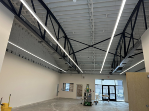 Modern commercial lighting installation in a large open space by BEC Contracting, LLC in Clover, SC.