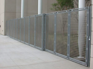 A modern commercial metal fence with horizontal slats installed by Superior Custom Fence Inc. in Chicago, IL.